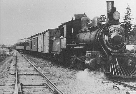The 2-6-0 Mogul #108 heads up a mixed train of the Canadian Northern Railway at Mackies Siding in 1918.